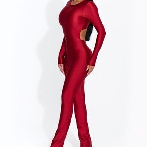 Red jumpsuit from Naked Wardrobe’s Sleek collection.